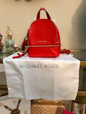Michael Kors Red Perforated Mini Backpack with Gold Hardware